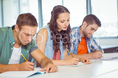 Fashion students taking notes in class