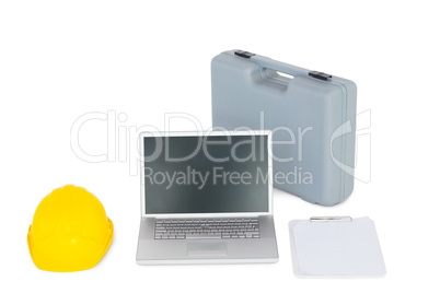Laptop with carpentary equipment on white