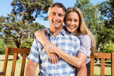 Couple relaxing in the park on bench