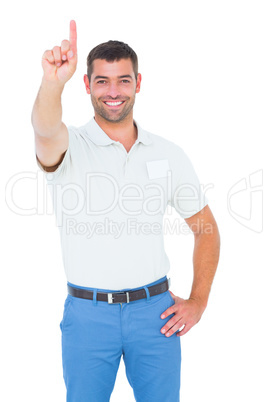 Male technician pointing upward on white background