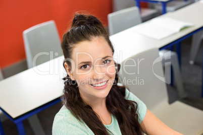 Portrait of smiling female student in classroom