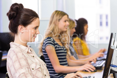 Side view of students in computer class