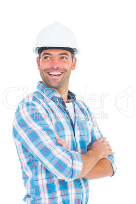 Smiling male worker standing arms crossed