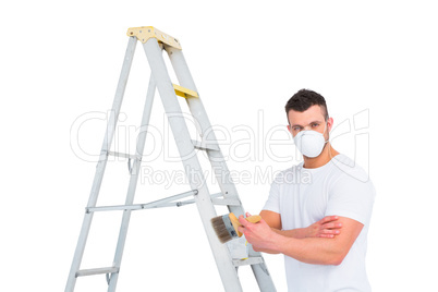 handyman with paintbrush and ladder handyman with paintbrush and ladder