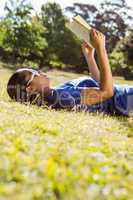 Pretty woman reading in the park