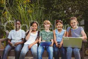 Children using technologies at park