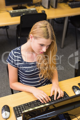 Student working on computer in classroom