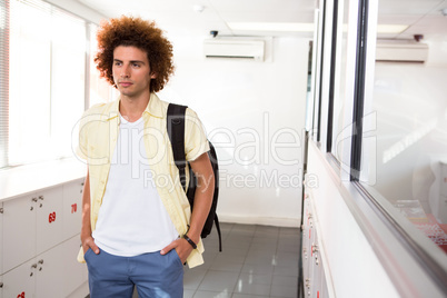 Casual young man in office corridor