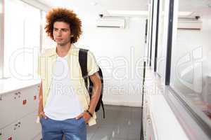 Casual young man in office corridor