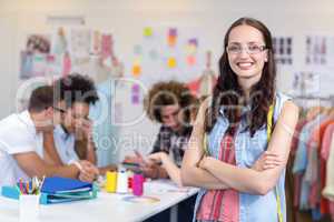 Confident female fashion designer with arms crossed