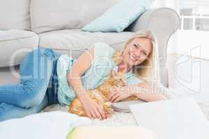 Happy woman with dog on rug