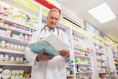 Smiling doctor reading a prescription