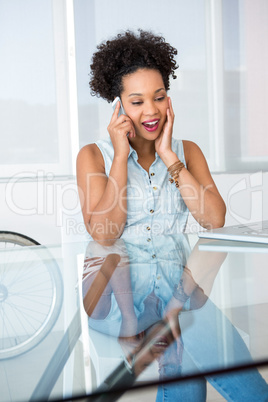 Young casual woman using cellphone