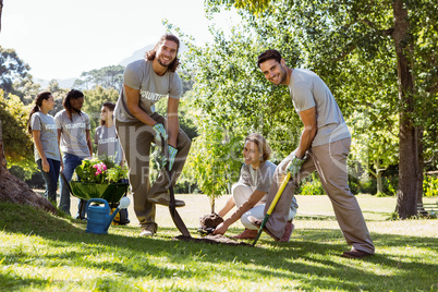 Team of volunteers gardening together