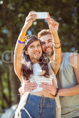 Hipster couple taking a selfie