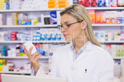 Pharmacist looking at medicine