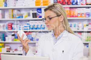 Pharmacist looking at medicine