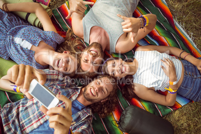 Happy hipsters having fun on campsite