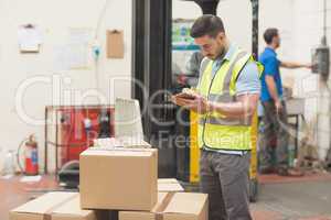 Warehouse worker with clipboard