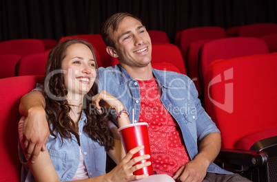 Young couple watching a film