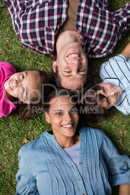 Happy family smiling at camera