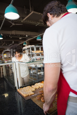 Smiling customer standing and choosing food