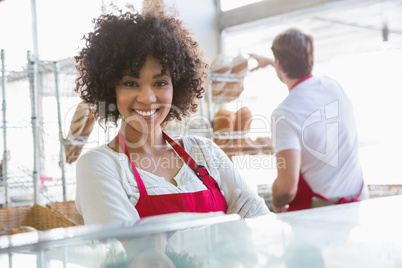 Pretty waitress posing with arms crossed