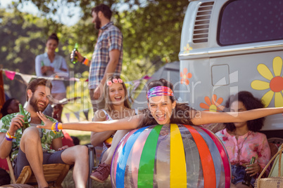 Happy hipsters having fun on campsite