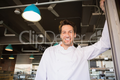 Portrait of a smiling baker standing