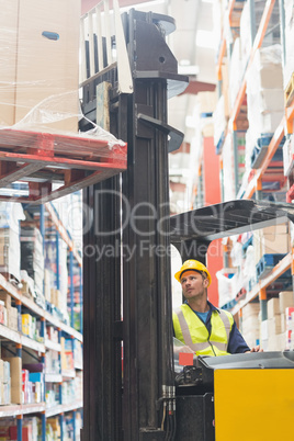 Focused driver operating forklift machine