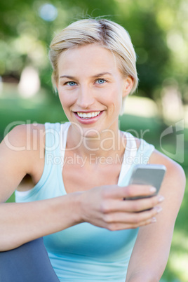 Pretty blonde using smartphone