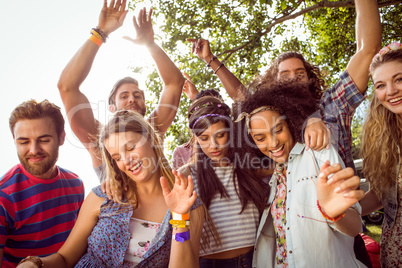 Happy hipsters dancing to the music