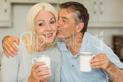 Mature couple having coffee together