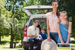 Happy family getting ready for road trip