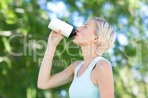 Pretty blonde drinking up water