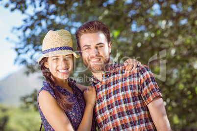 Hipster couple smiling at camera