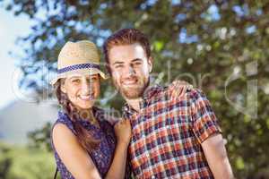 Hipster couple smiling at camera