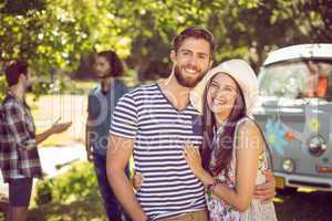 Hipster couple smiling at camera