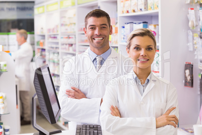 Team of pharmacists smiling at camera