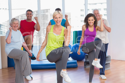 People doing power fitness exercise at fitness studio