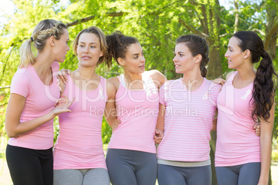 Smiling women in pink for breast cancer awareness