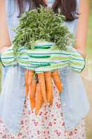 Woman holding her organic carrots