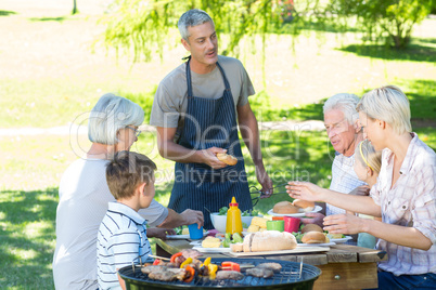 Happy family having picnic in the park