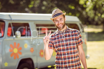 Handsome hipster smiling at camera