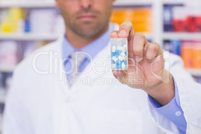 Pharmacist holding medicine jar