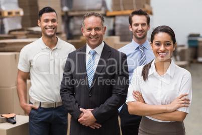 Warehouse team smiling at camera