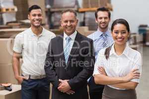 Warehouse team smiling at camera