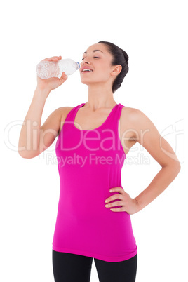 Fit woman taking a drink