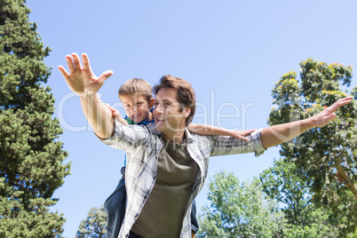 Father and son having fun in the park