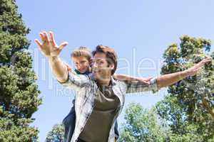 Father and son having fun in the park